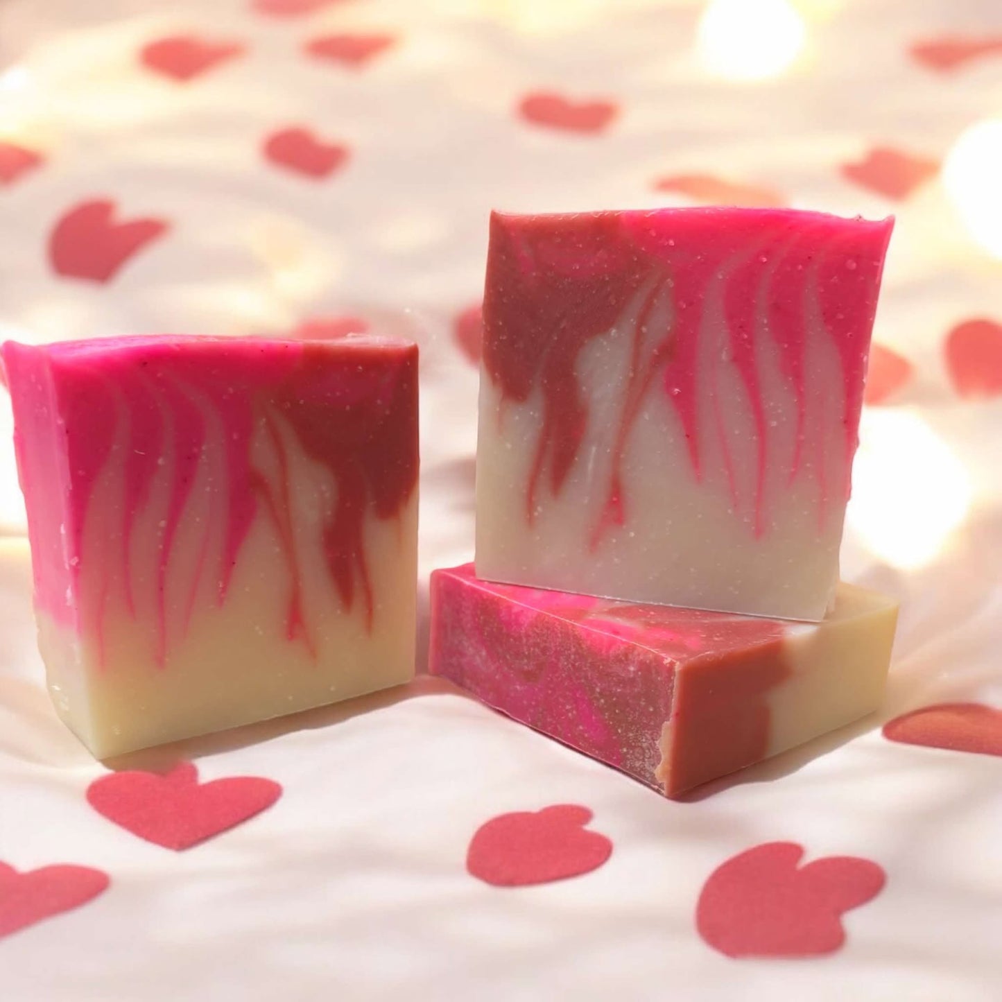 4oz. bar soap, colored white, pink and red. 
Green fruity floral bouquet with apple, rose and jasmine top notes with a sweet woodsy musky background.