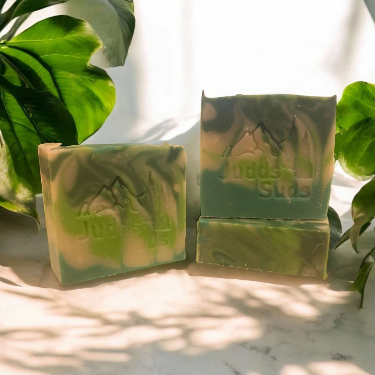 4oz soap bar, colored lime green, teal and while. Scented with cannabis flower fragrance oil