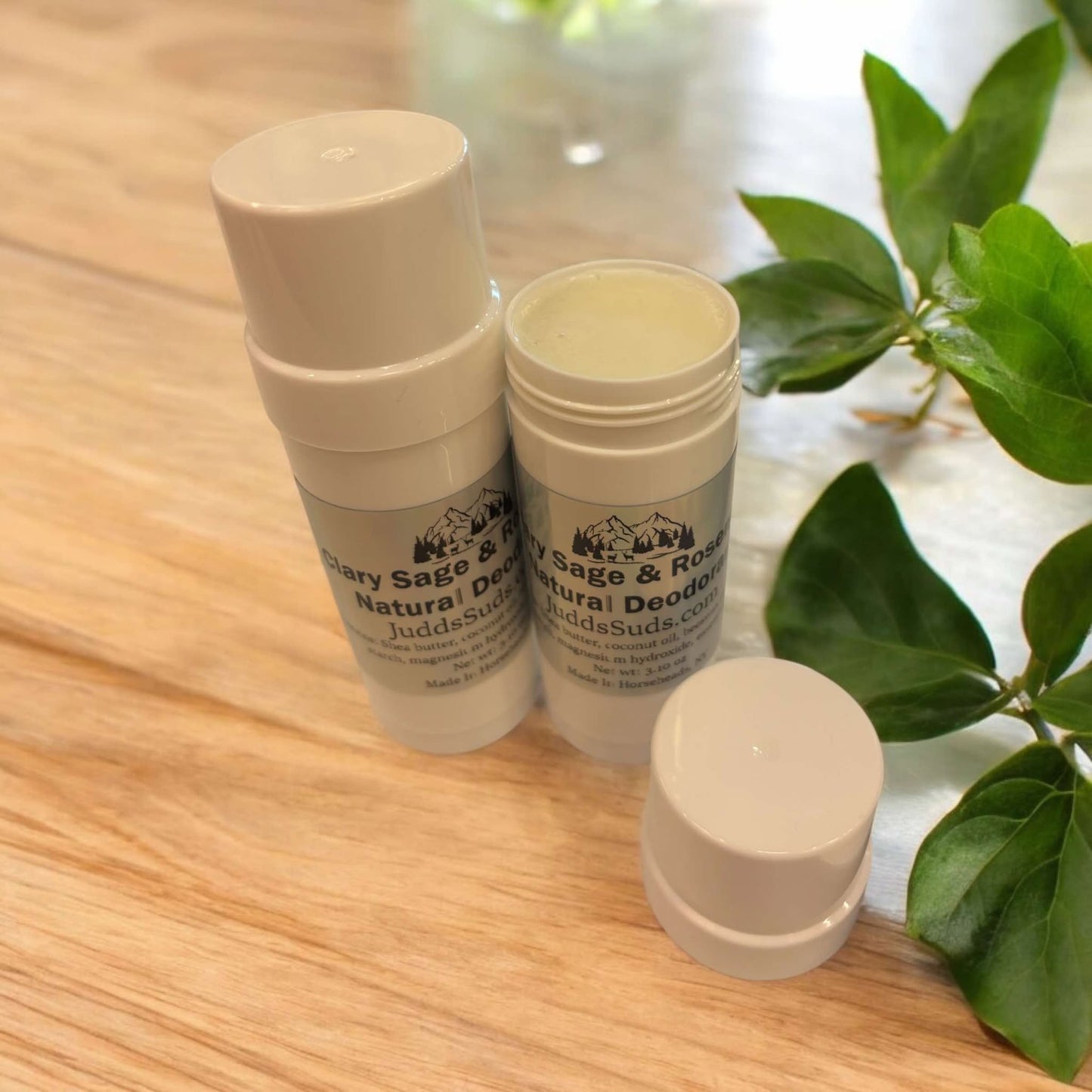 White canister containing 3oz of deodorant, plain white colored, scented with clary sage & rosemary essential oil