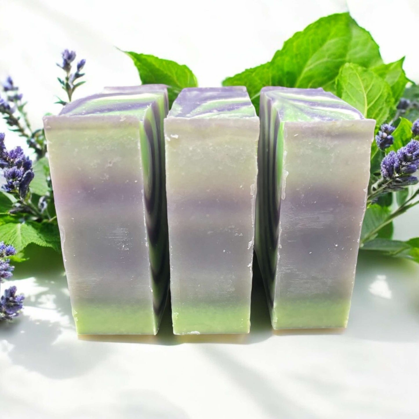 4oz soap bar, colored in purple, green and white. Scented with lavender mint fragrance oil.