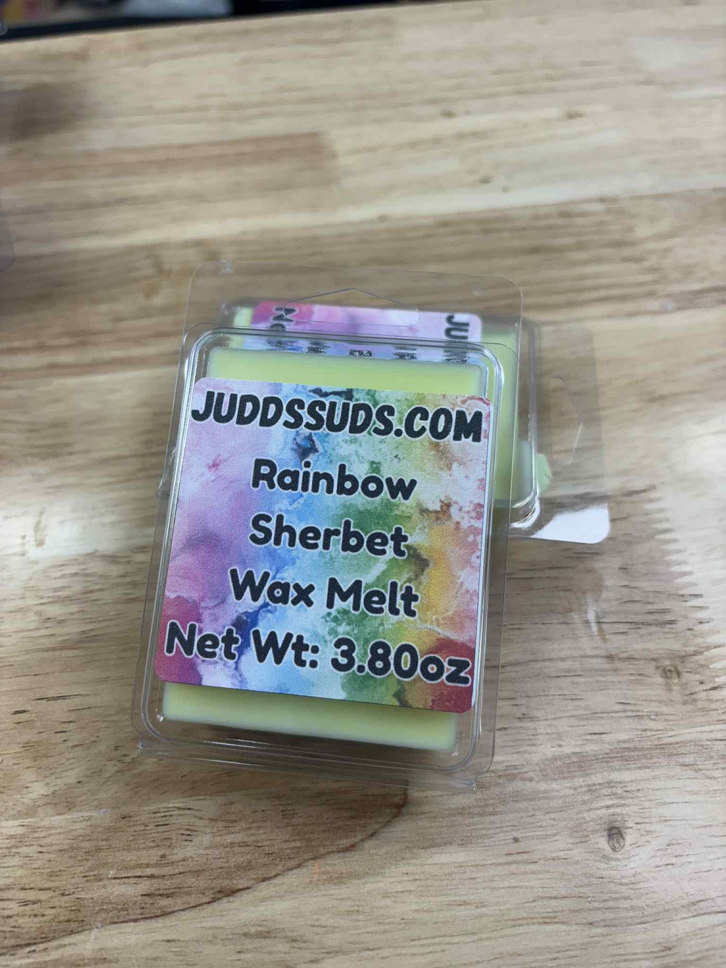 3.8oz wax melt, colored yellow, scented with rainbow sherbet fragrance oil