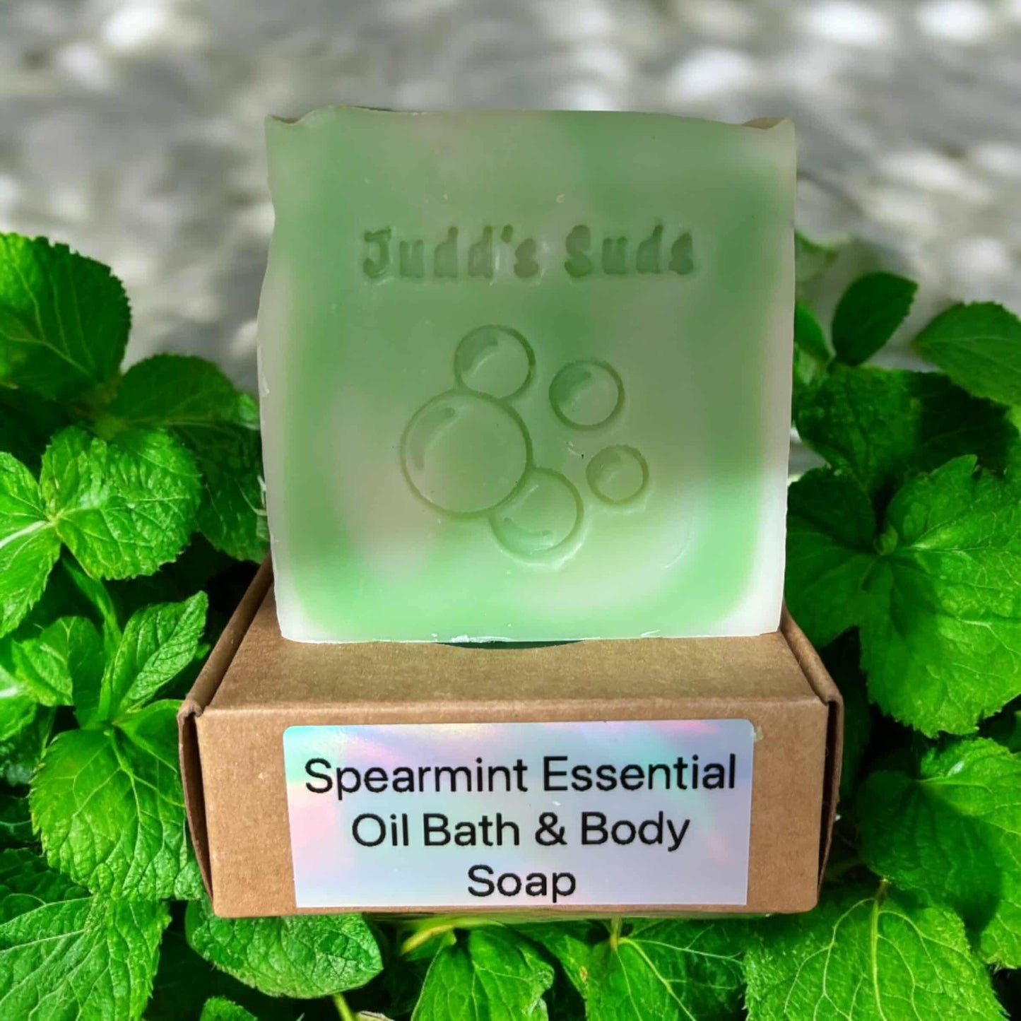 4oz soap bar, colored green and white, scented with spearmint essential oil