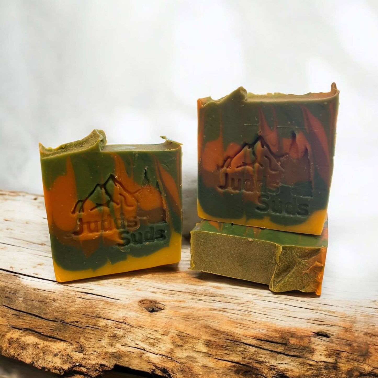 4oz soap bar, colored green, teal, gold and brown. Scented with sun baked whisky fragrance oil