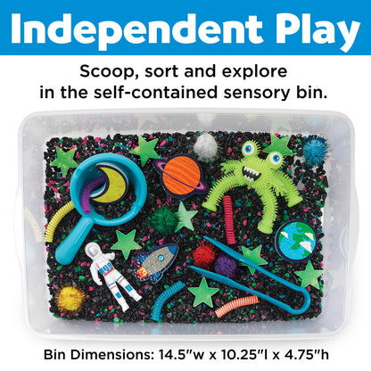 Alien sensory bin, contains space rocks, astronaut toy, squishy alien, foam planets, sparkly pom poms, tongs, spirals, glow in the dark stars, and scoop.