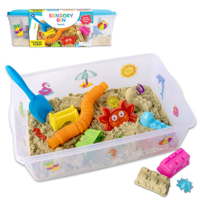 Sensory bin with beach-themed toys and sand on a white background