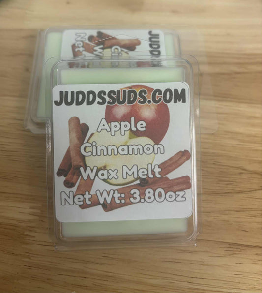 Apple Cinnamon wax melt packaging with Judds Suds.com label on a wooden surface