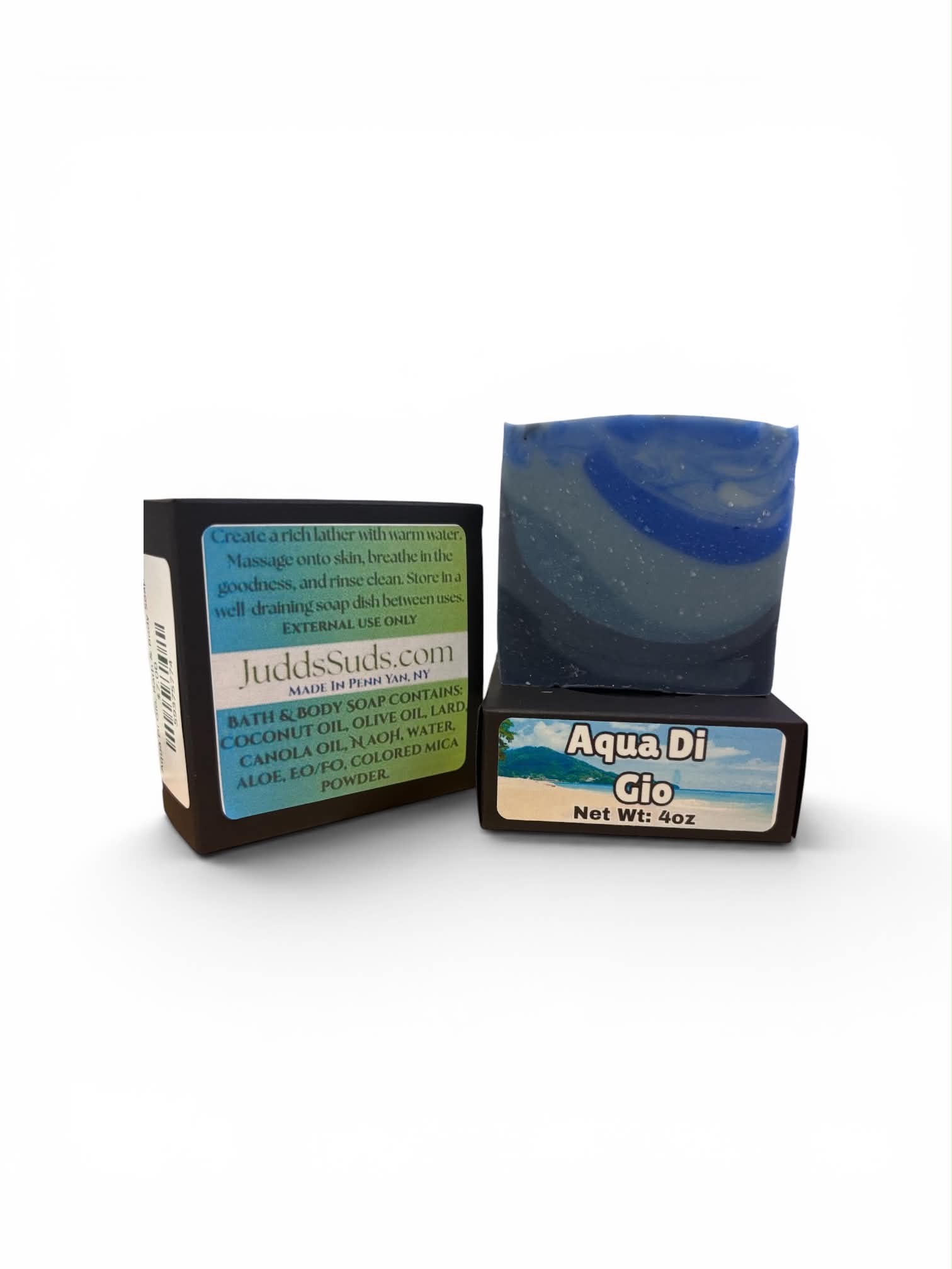 A handmade bar of blue soap labeled 'Aqua Di Gio' next to its black and blue retail box on a white background.