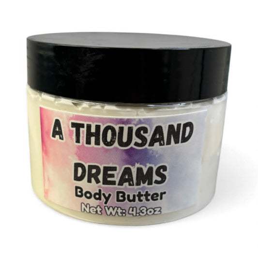 Jar of 'A Thousand Dreams' body butter with a colorful label on a white background