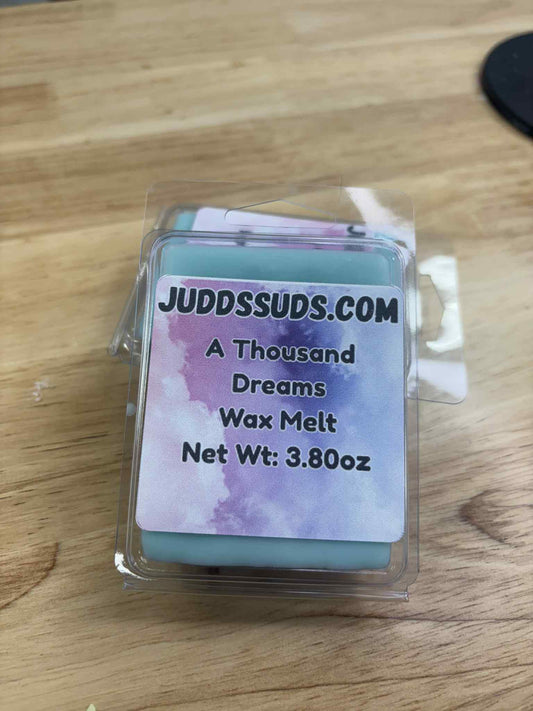 3.80oz wax melt, colored teal, scented with A Thousand Dreams fragrance oil