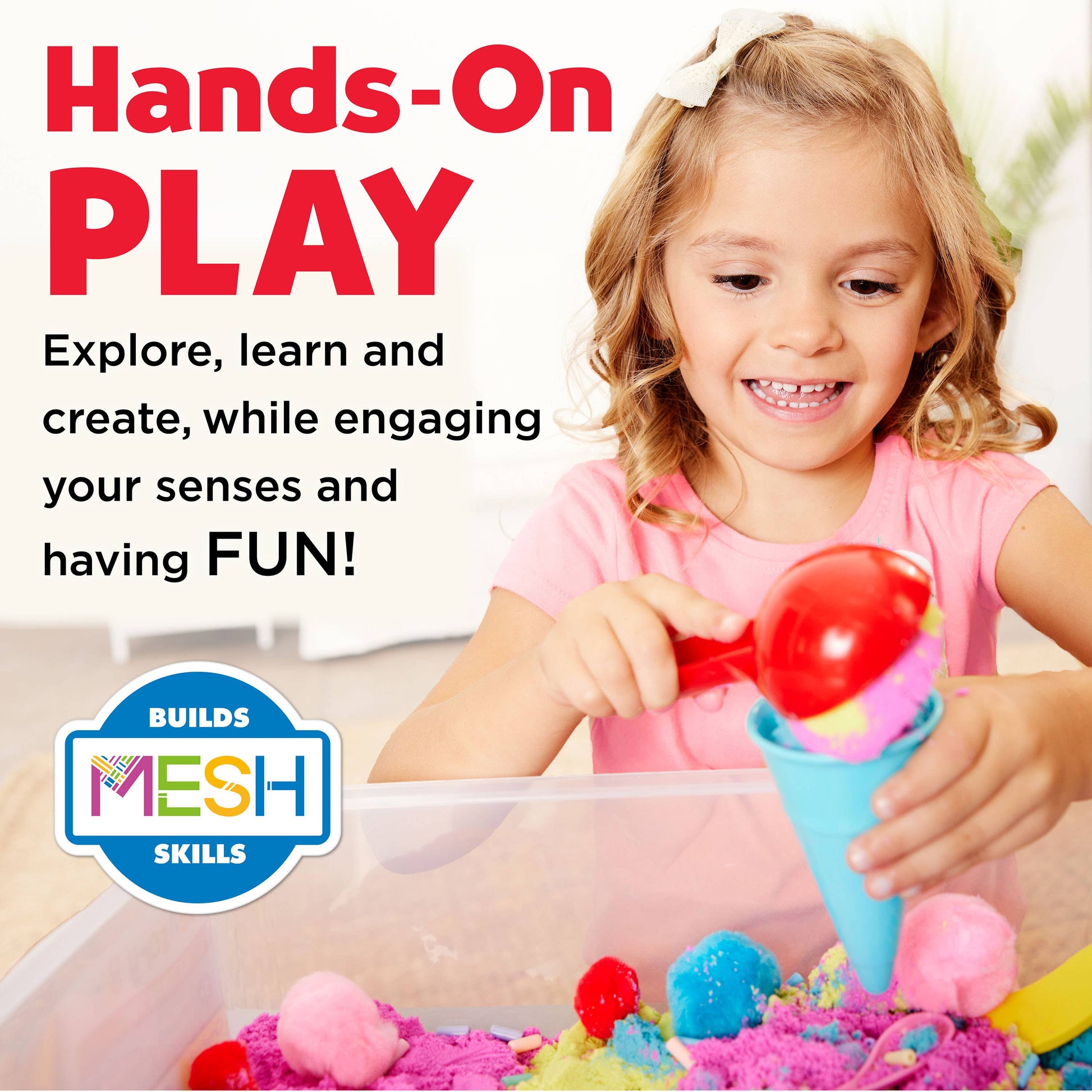 Sensory bin contains, sensory sand, foam bananas, ice cream cones, spoon, ice cream scoop, rainbow beads, bowl, and pom poms