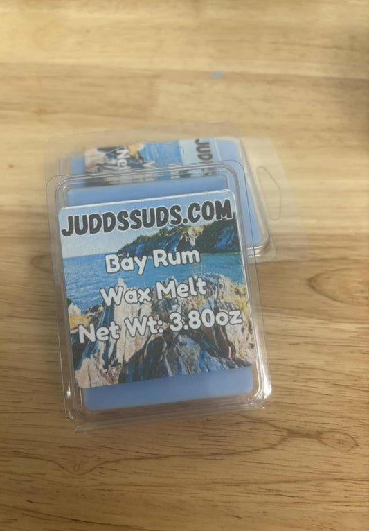 Wax melt package labeled 'JuddsSuds.com' on a wooden surface