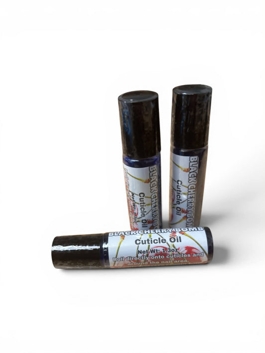 Three bottles of cuticle oil with black caps on a white background
