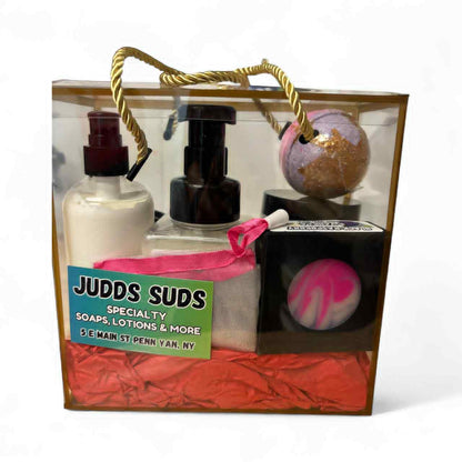 Gift set with soaps, lotions, and bath bombs from Judds Suds in a clear box.