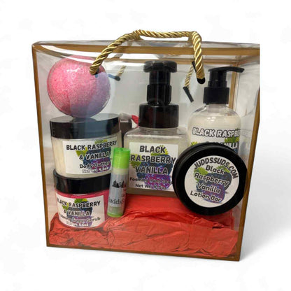 Gift set with Black Raspberry Vanilla products in a clear box on a white background