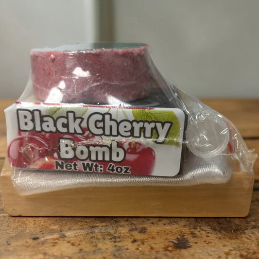 Black Cherry Bomb product packaging on a wooden surface
