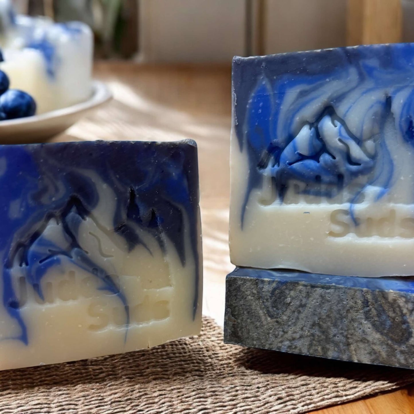 Soap bar, 4oz, colored blue and white, scented with blueberry cheesecake fragrance oil. 