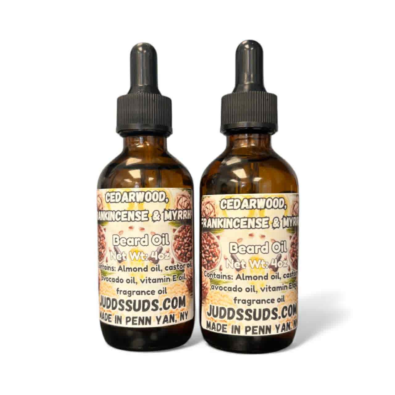 Two bottles of Judd Suds beard oil with labels on a white background