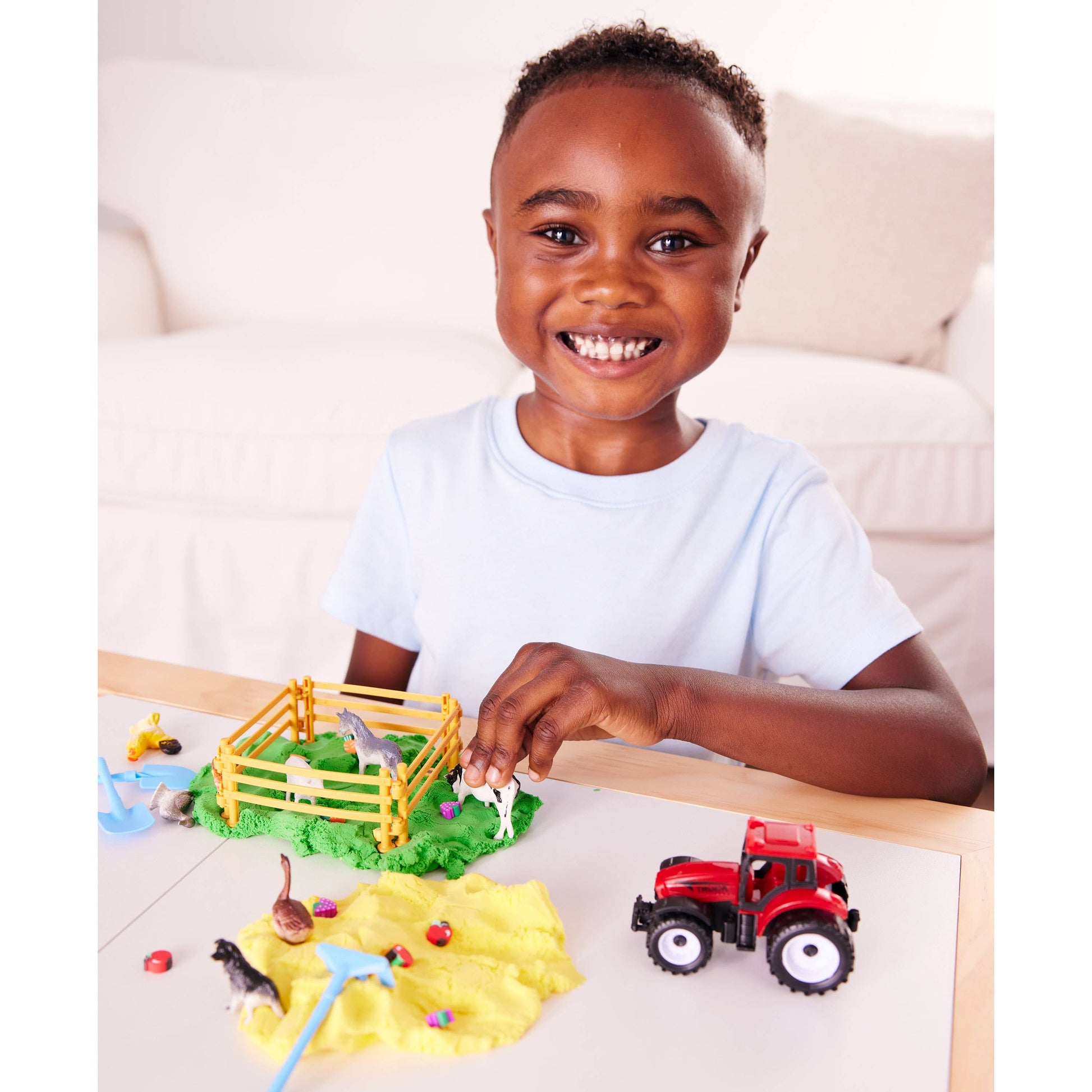 Sensory bag contains, tractor, clay beads, spade, shovel, rake, farm animals. fences, cloud clay.