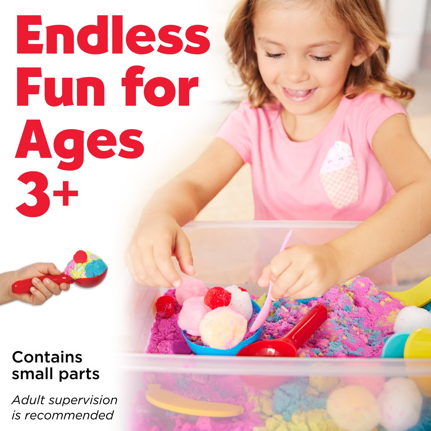 Sensory bin contains, sensory sand, foam bananas, ice cream cones, spoon, ice cream scoop, rainbow beads, bowl, and pom poms
