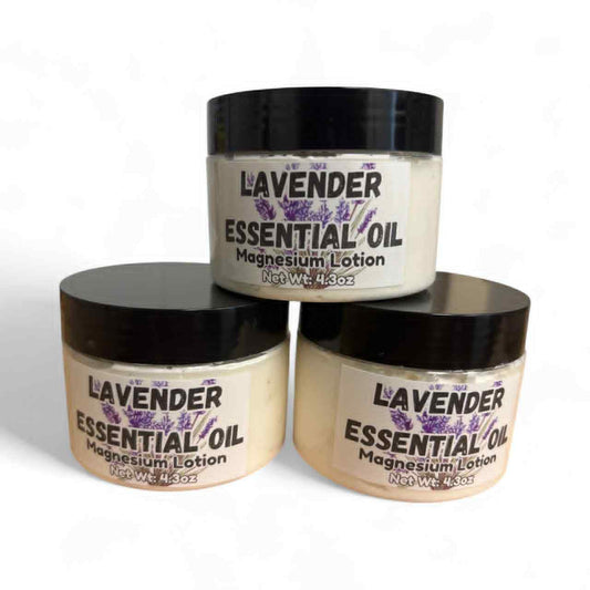 Three jars of lavender essential oil magnesium lotion on a white background