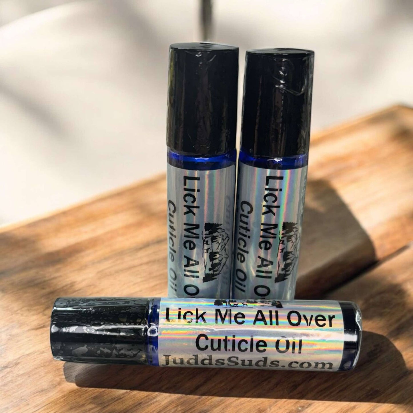 glass roller bottle containing nourishing oils to help hydrate your cuticles. Scented with lick me all over fragrance oil