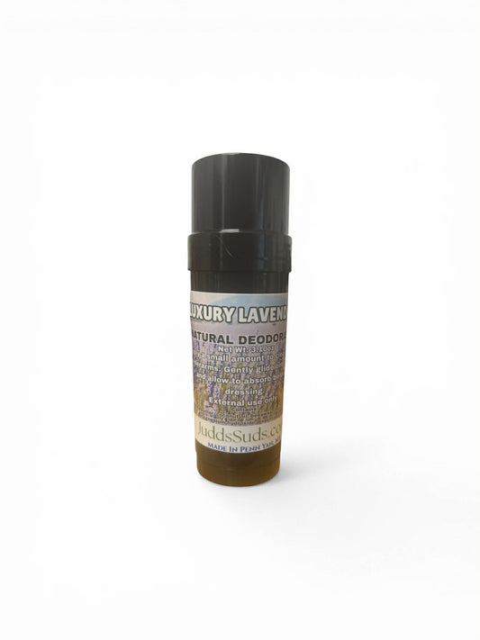 Deodorant stick with black cap on a white background
