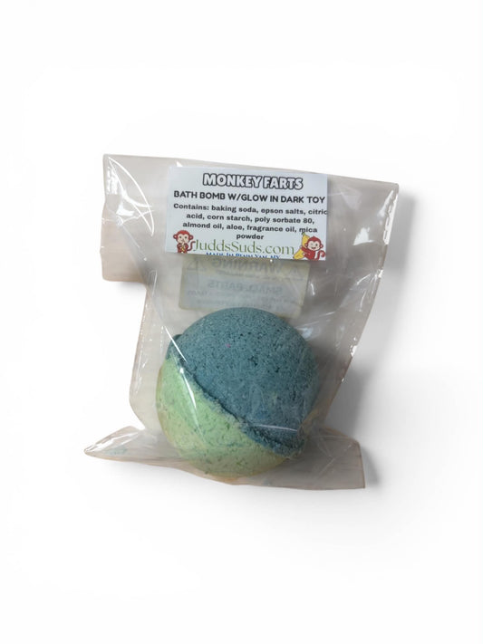 Blue bath bomb with packaging labeled 'Monkey Farts' on a white background