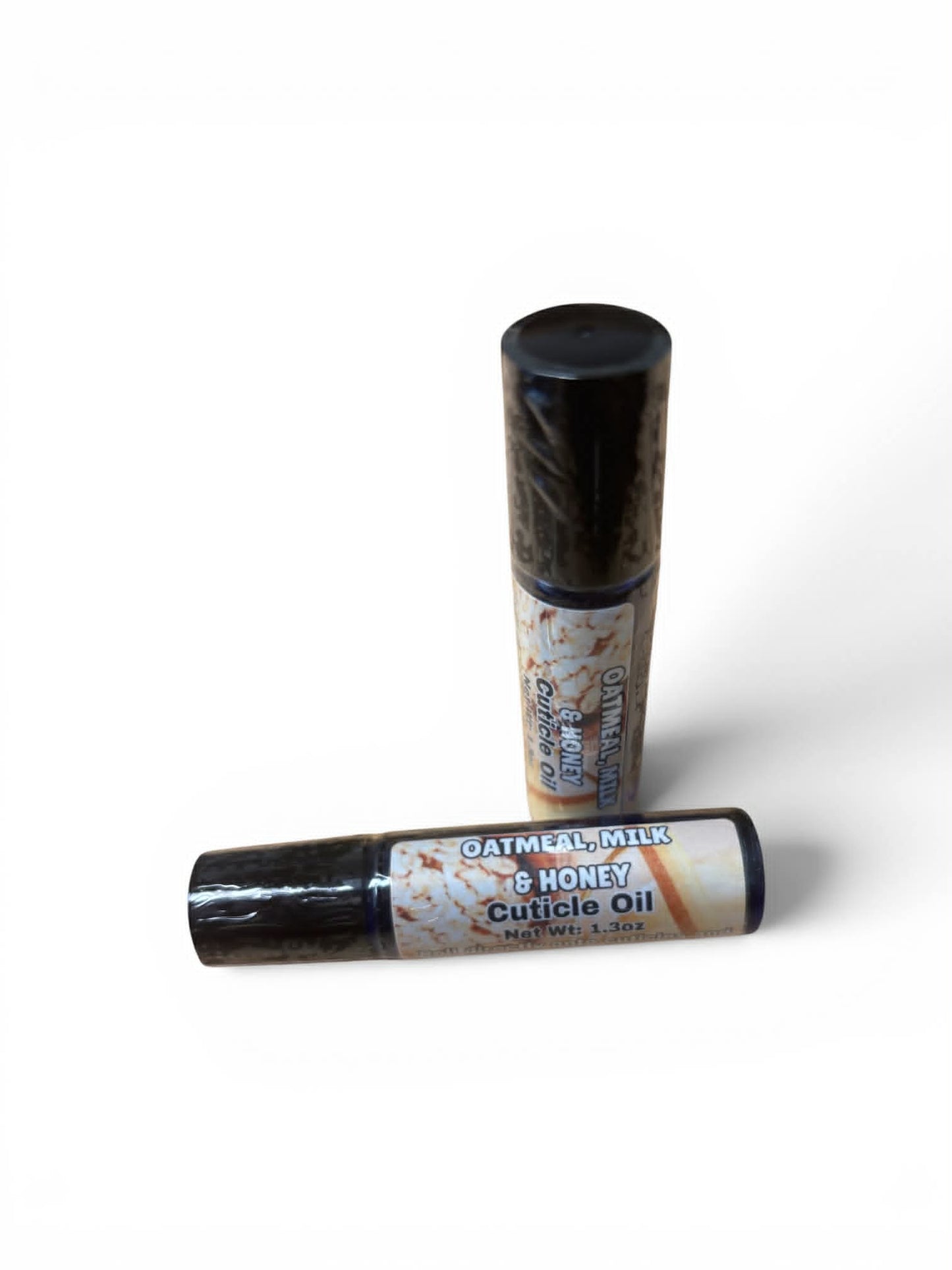 Two bottles of Oatmeal Milk & Honey cuticle oil on a white background