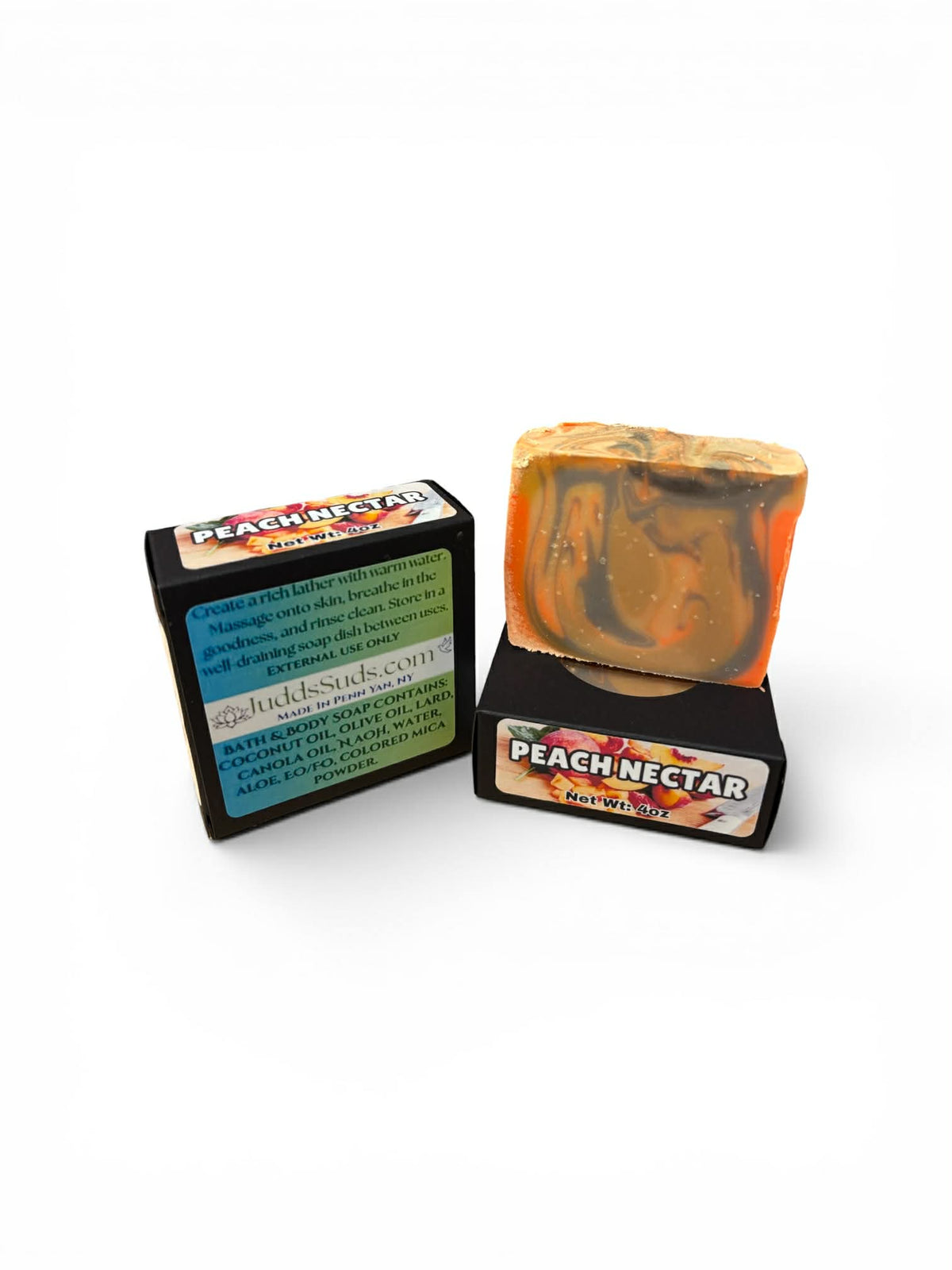 Bar of soap with packaging labeled 'Peach Nectar' on a white background