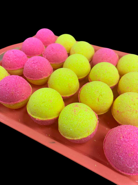 Round 4.3oz bath bombs, colored in yellow and pink. Scented with rainbow sherbet