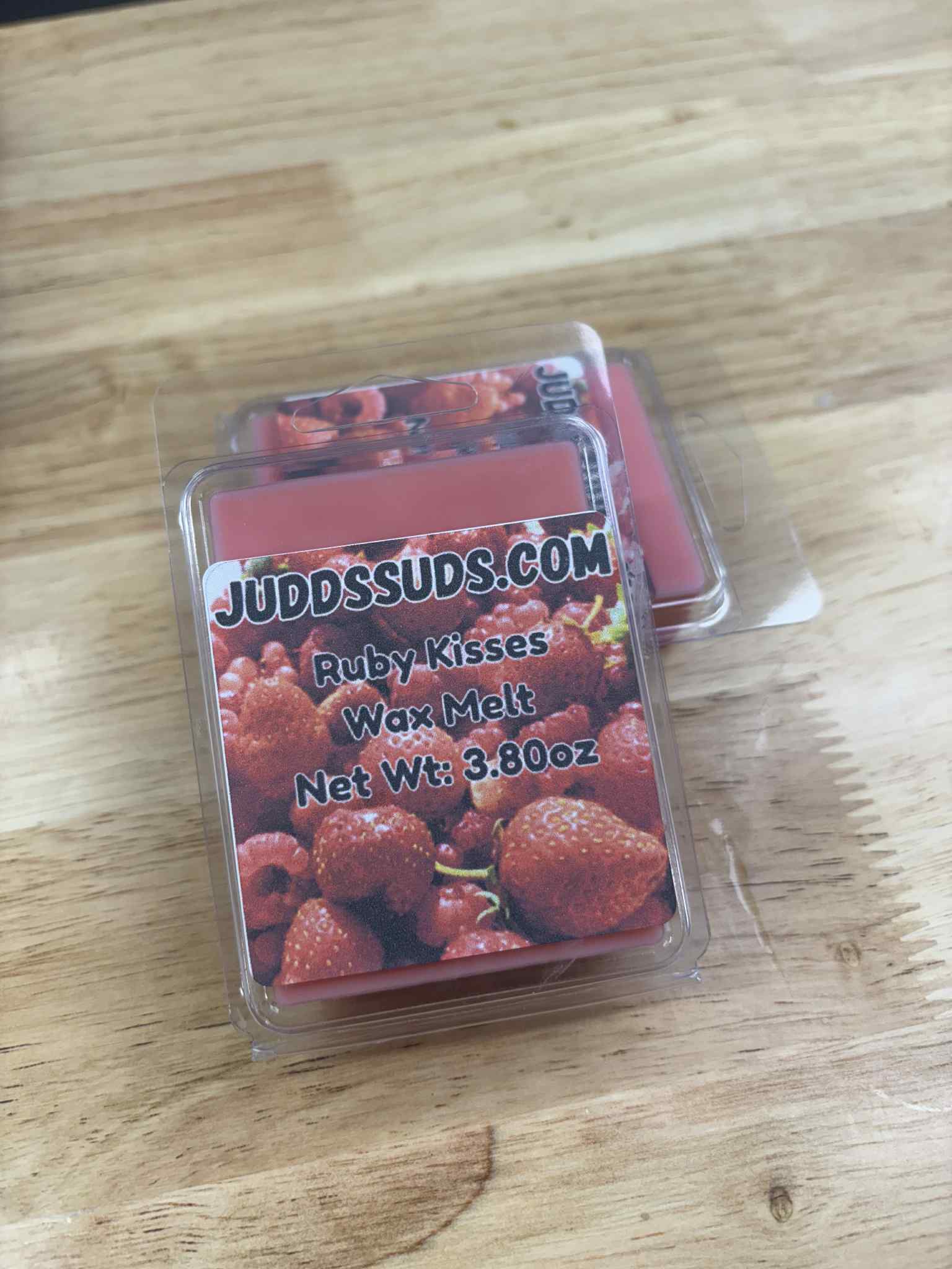 3.8oz wax melt, colored red, scented with ruby kisses fragrance oil