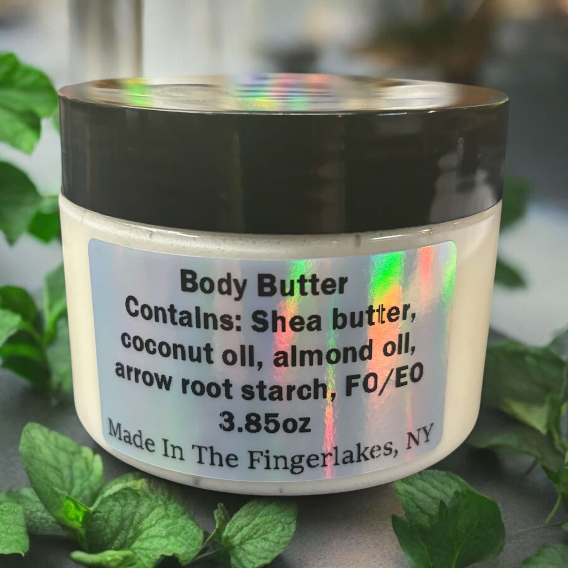 4oz jar of body butter, plain white color, scented with spearmint essential oil