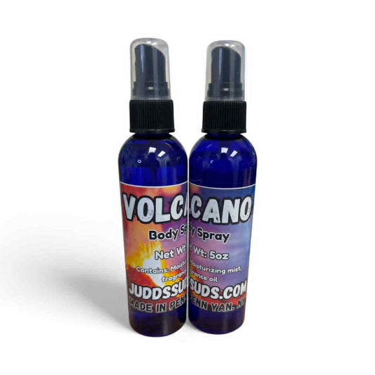 Two bottles of Volcano body spray with colorful labels on a white background