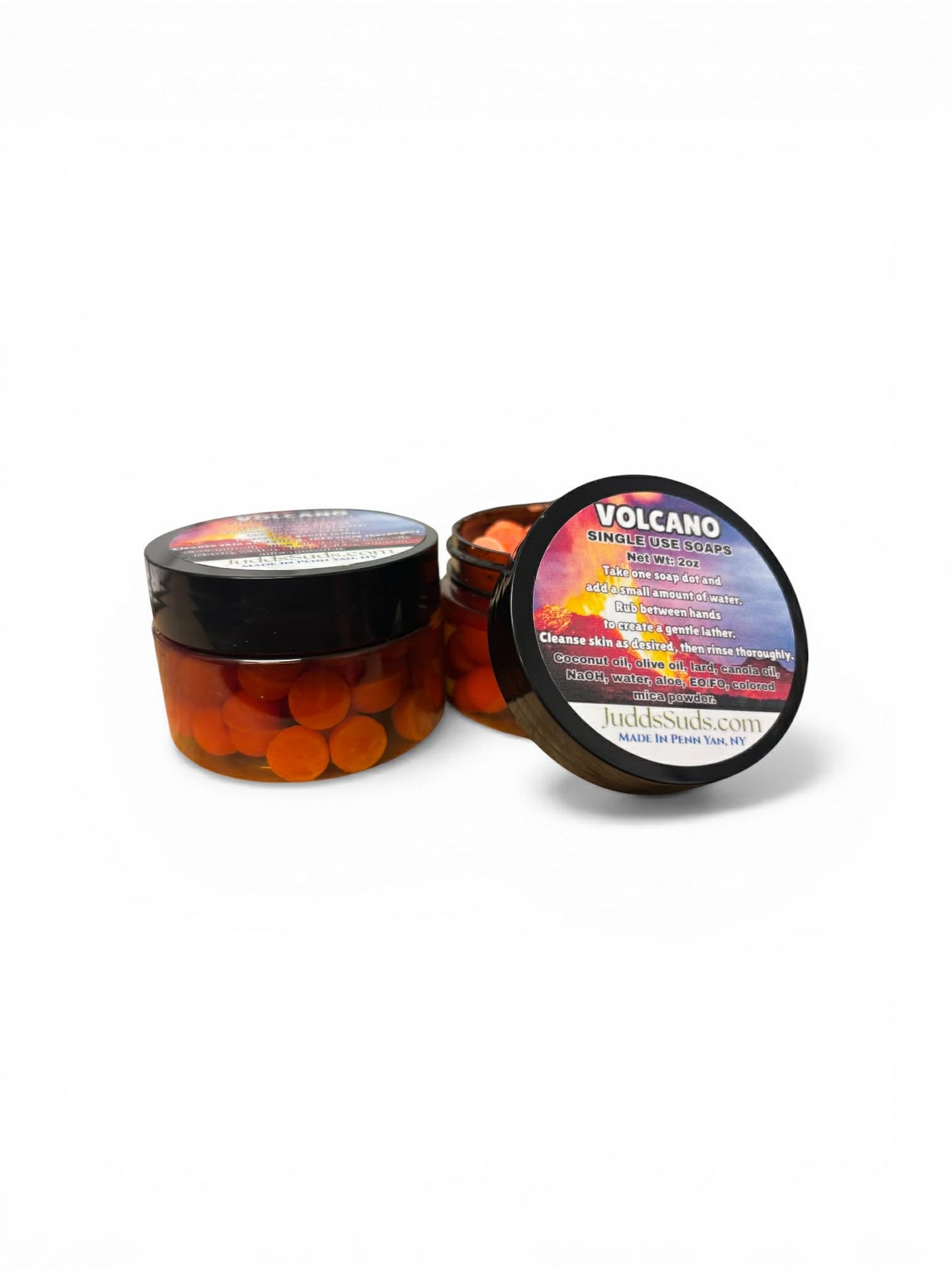 Two jars of 'Volcano' single use soaps with colorful labels on a white background.